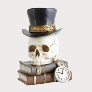 A top hat wearing white skull atop a stack of rein books 6.5"W x 7.5"L x 11"H, halloween, Halloween decor, Home Decor, Decor, Third & Main