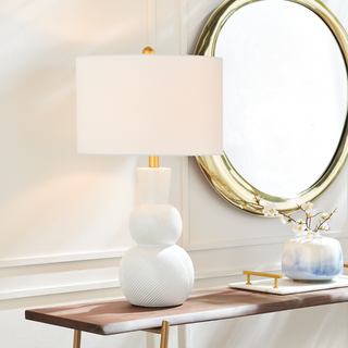 In a classic clean white ceramic with hand carved markings along the body, this lamp is made for the traditional setting. A generally scaled white linen shade &amp; simple brass finial finish off the look.Max wattage: 100W;-Socket: E26
Third & Main, Home Decor, Lighting, Table Lamp, Side Table Lamp, Contemporary Lighting, Luxury Home, Luxury Lighting, Hand Carved Detail